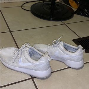 All white Nike Roshes